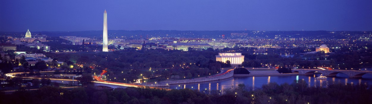 A scenic view from across the Potomac River that includes the Lincoln Memorial, the Washington Monument and the Capitol Building.